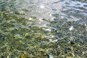 pebble stones into the clean water