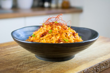 Food photography of a black bowl with red rice