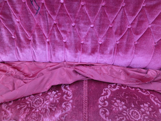 purple velvet upholstery of an old couch