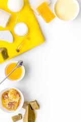 Aromatic theraphy and delicate skin care. Spa set based on honey on white background top view copy space