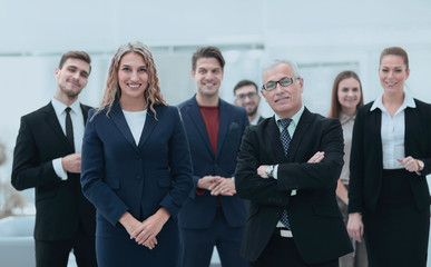 businessman and business woman standing in front of the business team.