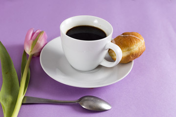 cup of coffe with tulip and cookie