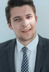 closeup.the face of a successful young man