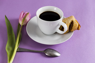 cup of coffe with tulip and cookie