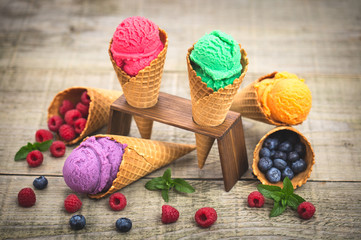 Fototapeta na wymiar Various homemade fruit ice cream in the cone