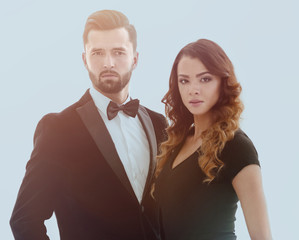 Portrait of a handsome man looking at the camera with a woman