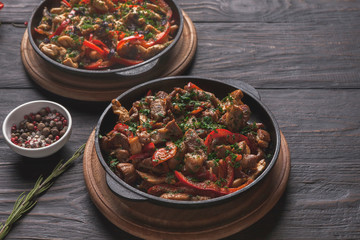 Roasted meat and vegetable on wooden table