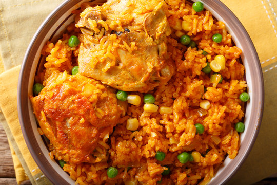 traditional spicy Brazilian food: chicken and rice close-up on a plate. horizontal top view