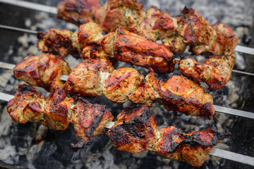 Barbecue or shish kebab is fried on the grill.