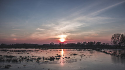 Sunset in winter at a river