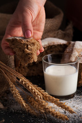 Freshly baked homemade rye flour bread and glass of milk. Kitchen or bakery poster design