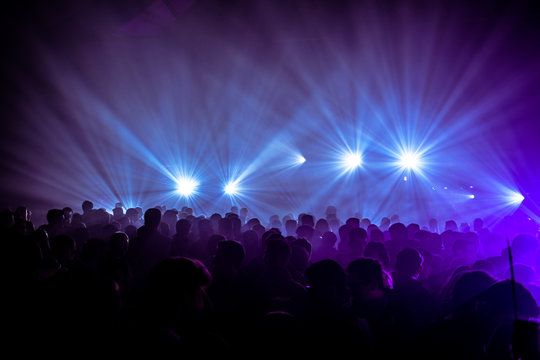 People dancing in lights