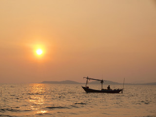 Beautiful sunset over the sea and Fishing boat