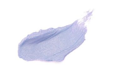 Cosmetics products smeared on white