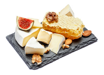 Camembert cheese with honey, figs, walnuts on stone board