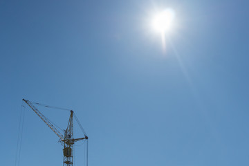 Obraz premium construction crane on blue sky