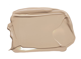 Light beige makeup smear of creamy foundation