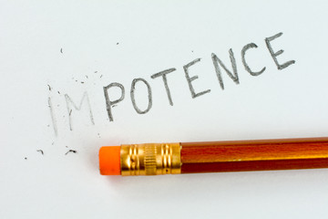 changing the word impotence with pencil eraser - obrazy, fototapety, plakaty