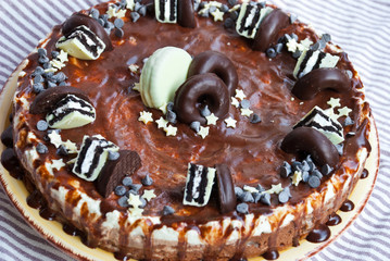 Homemade cake three chocolates. Mousse glaze darkness decoration cake.