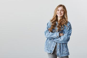 Happy to have great friends near. Portrait of grinning attractive caucasian female student with...