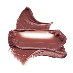 Texture of brown lipstick isolated on white. Smear of broken brown lip gloss