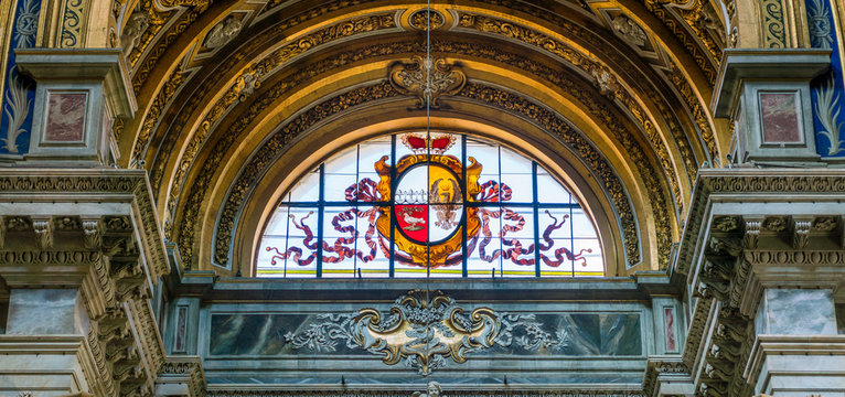 Stained glass with shield and eagle in the Church of Sant'Agnese in Agone in Rome, Italy.
