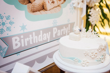 idea of a cake with mastic, bear and snowflakes for the birthday of the child