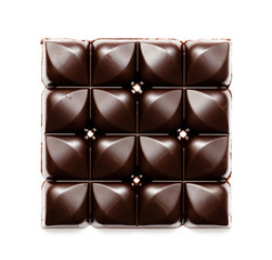 Full chocolate pieces. Chopped dark chocolate closeup isolated
