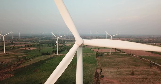 Wind turbine renewable energy source summer landscape with blue sky