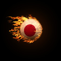 Fototapeta premium A soccer ball with the flag of Japan burning with fire flies on a black background