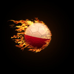 Fototapeta premium A soccer ball with the flag of Poland burning with fire flies on a black background