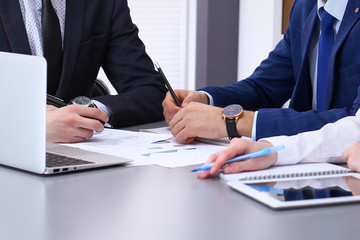 Group of businesspeople analyzing financial documents.  Business team at meeting