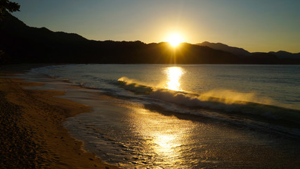 Trindade beach during sunset in Brazil.