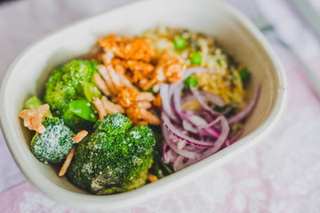 healthy office lunch box with mized vegetables salad