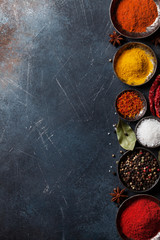 Colorful spices on stone table © Evgeny Karandaev