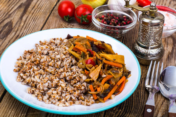 Vegetarian dish. Grain porridge with stewed vegetables