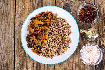 Vegetarian dish. Grain porridge with stewed vegetables