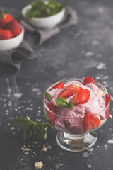 Strawberry dessert. English berry trifle, cheesecake, parfait. Berry mousse in glass on a dark background, copy space