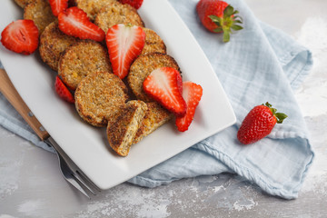 Vegan sweet tofu fritters with strawberries, light background. Healthy vegan food concept.
