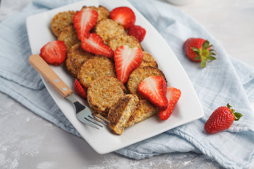 Vegan sweet tofu pancakes with strawberries. Healthy vegan food concept.