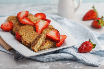 Vegan breakfast sweet tofu fritters (pancakes) with strawberries. Healthy vegan food concept.