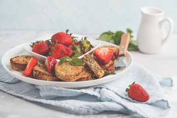 Vegan breakfast sweet tofu fritters (pancakes) with strawberries. Healthy vegan food concept.