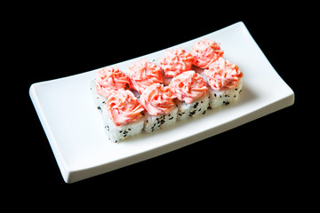Traditional fresh japanese set sushi rolls isolated on a black background.