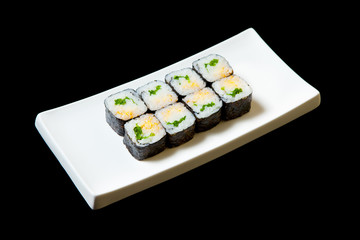 Traditional fresh japanese set sushi rolls isolated on a black background.