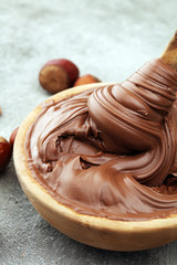 Homemade hazelnut spread in wooden bowl. Hazelnut Nougat cream