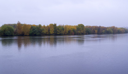 Fototapeta na wymiar calm river at rainy autumn morning. background, nature.