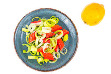 Salad with crab sticks on white background