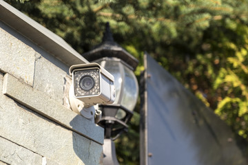Street surveillance camera on the fence.