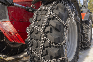 Close up of special snow chains with spikes on a wehicle