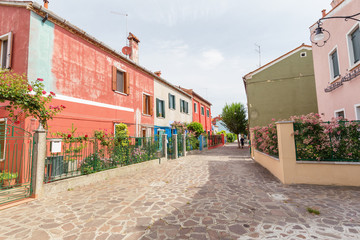 Small, cozy courtyard with colorful cottage /  Burano, Venice/ The small yard with bright walls of houses.